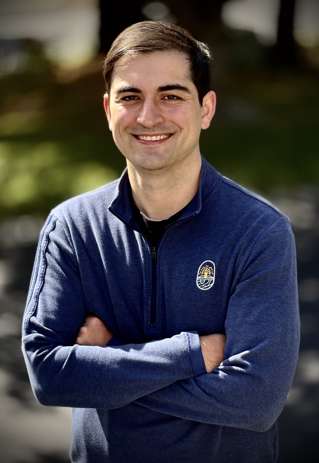 Arban Nazarko, founder of Score 54 Math, wearing a navy quarter-zip